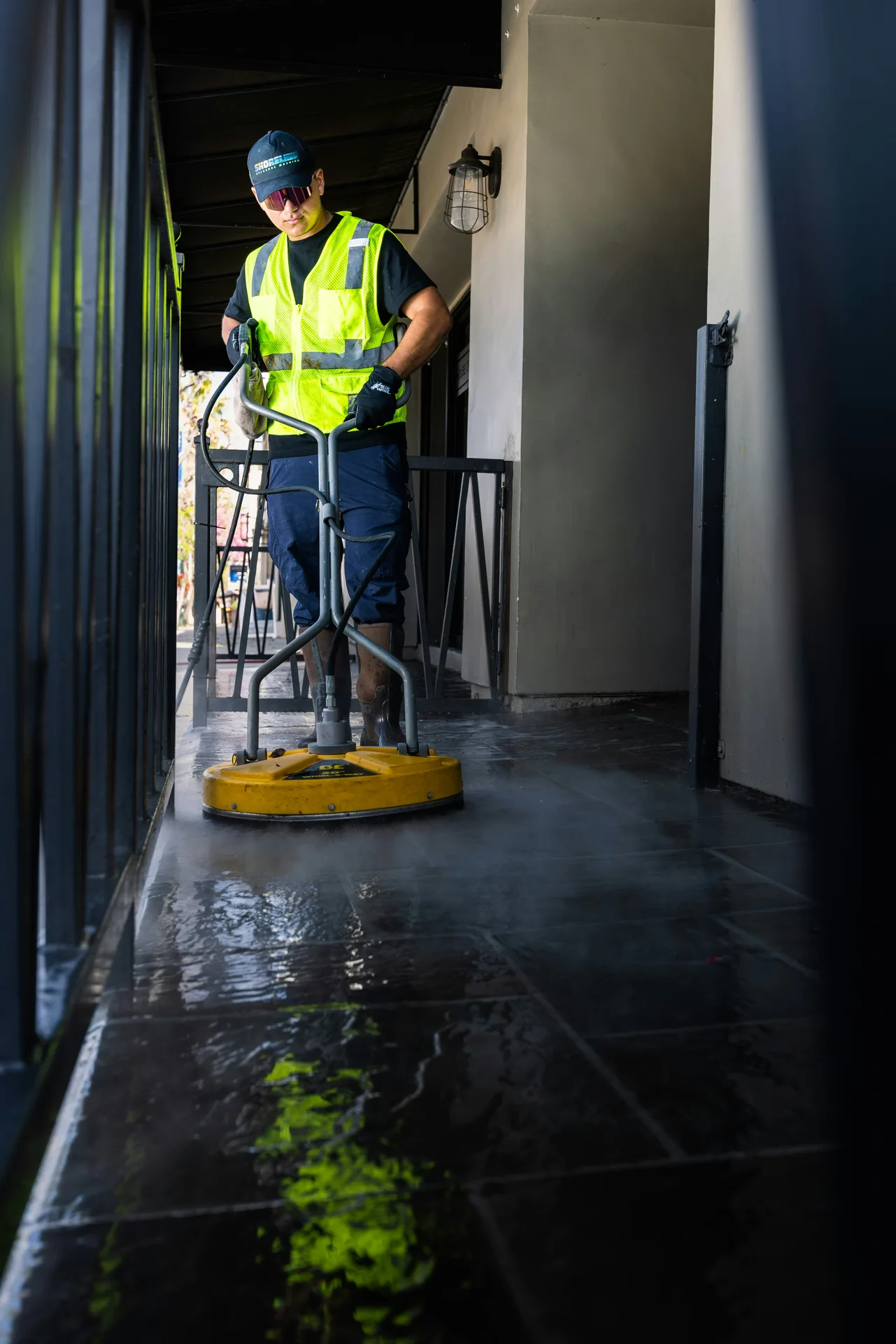 Technician Using Surface Cleaner on /oil-stain-removal/ — Rockland Windows Minneapolis